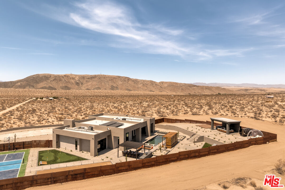 6765 Swanson Road Joshua Tree, CA 92252 - Photo 68 of 69 a view of a city that has tall buildings in the background
