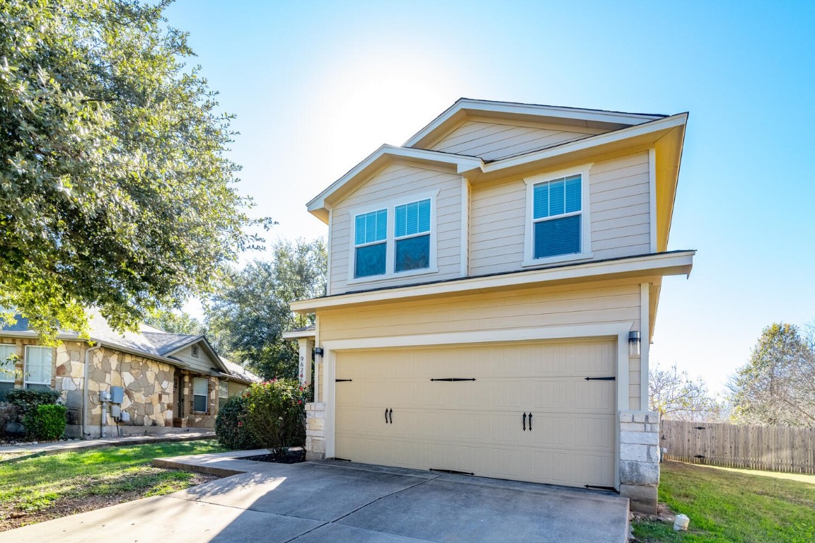 9628 Beechnut Drive Austin, TX 78748 - Photo 1 of 1 a front view of a house with garden