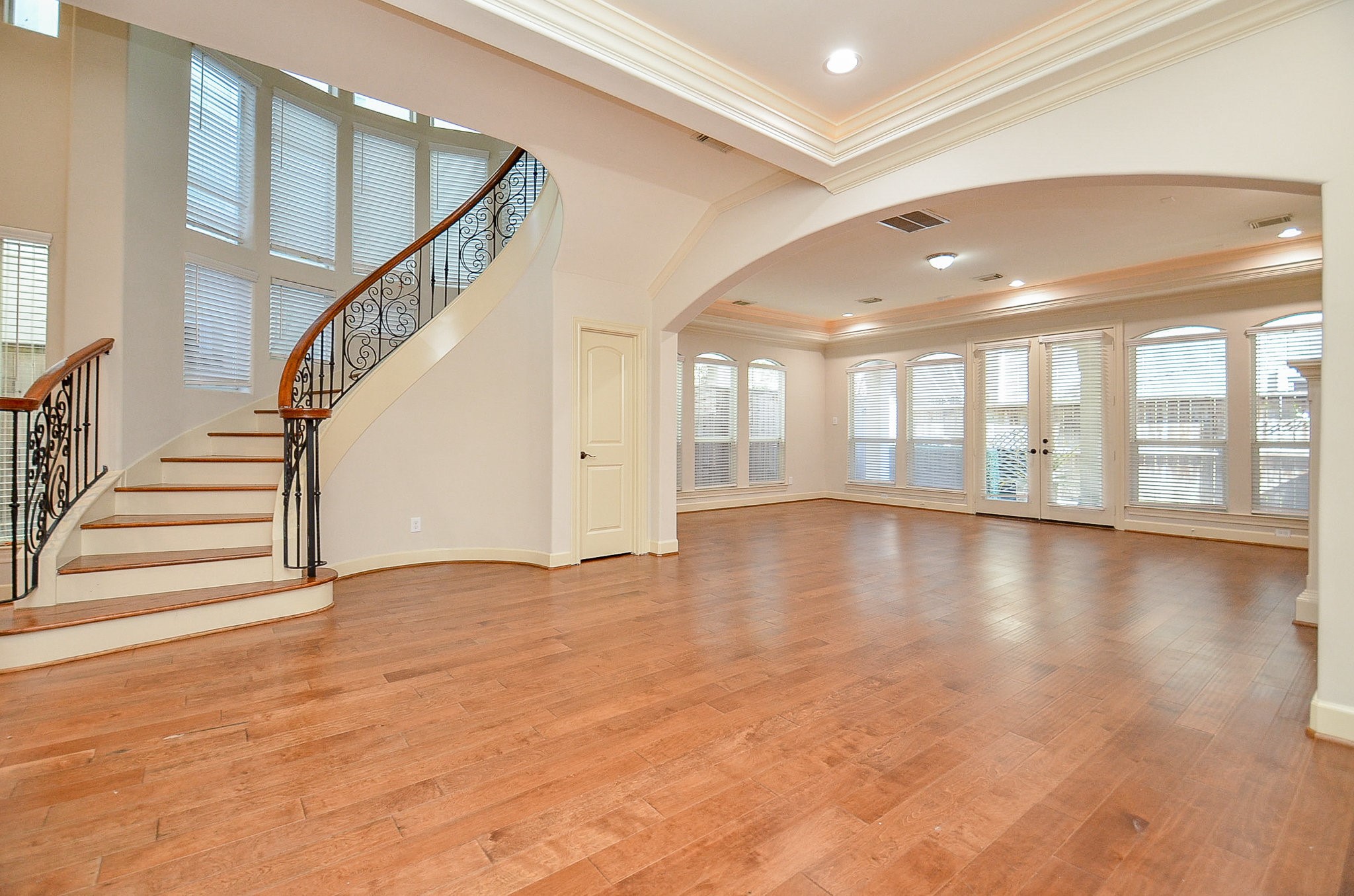 5512 Hidalgo Street Houston, TX 77056 - Photo 14 of 32 a view of an empty room with wooden floor and a window