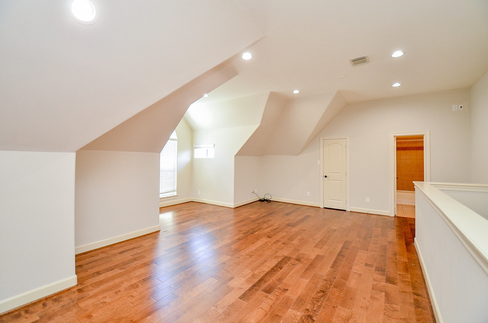5512 Hidalgo Street Houston, TX 77056 - Photo 27 of 32 a view of an empty room with wooden floor