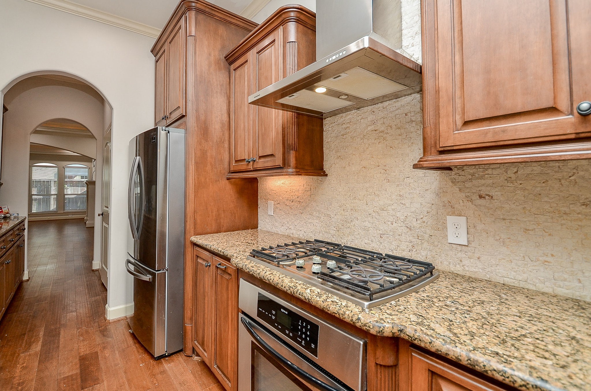 5512 Hidalgo Street Houston, TX 77056 - Photo 9 of 32 a kitchen with stainless steel appliances granite countertop a stove and a refrigerator