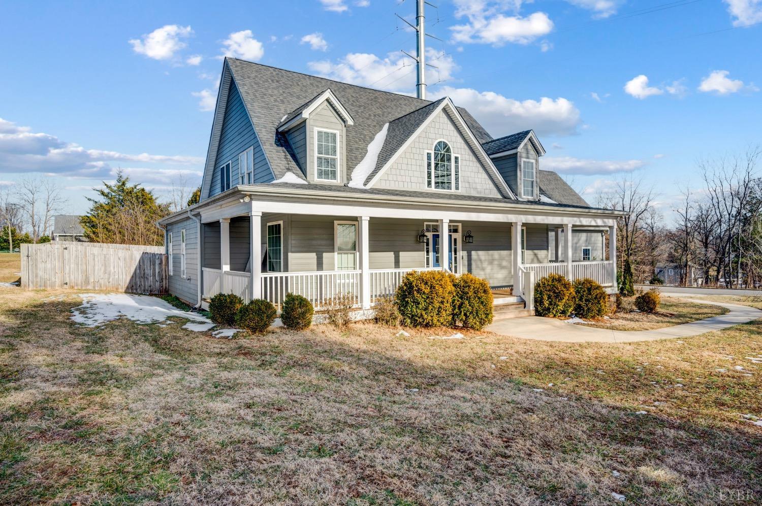 4802 Old Boonsboro Road Lynchburg, VA 24503 - Photo 2 of 57 a front view of a house with a yard outdoor seating and covered with trees
