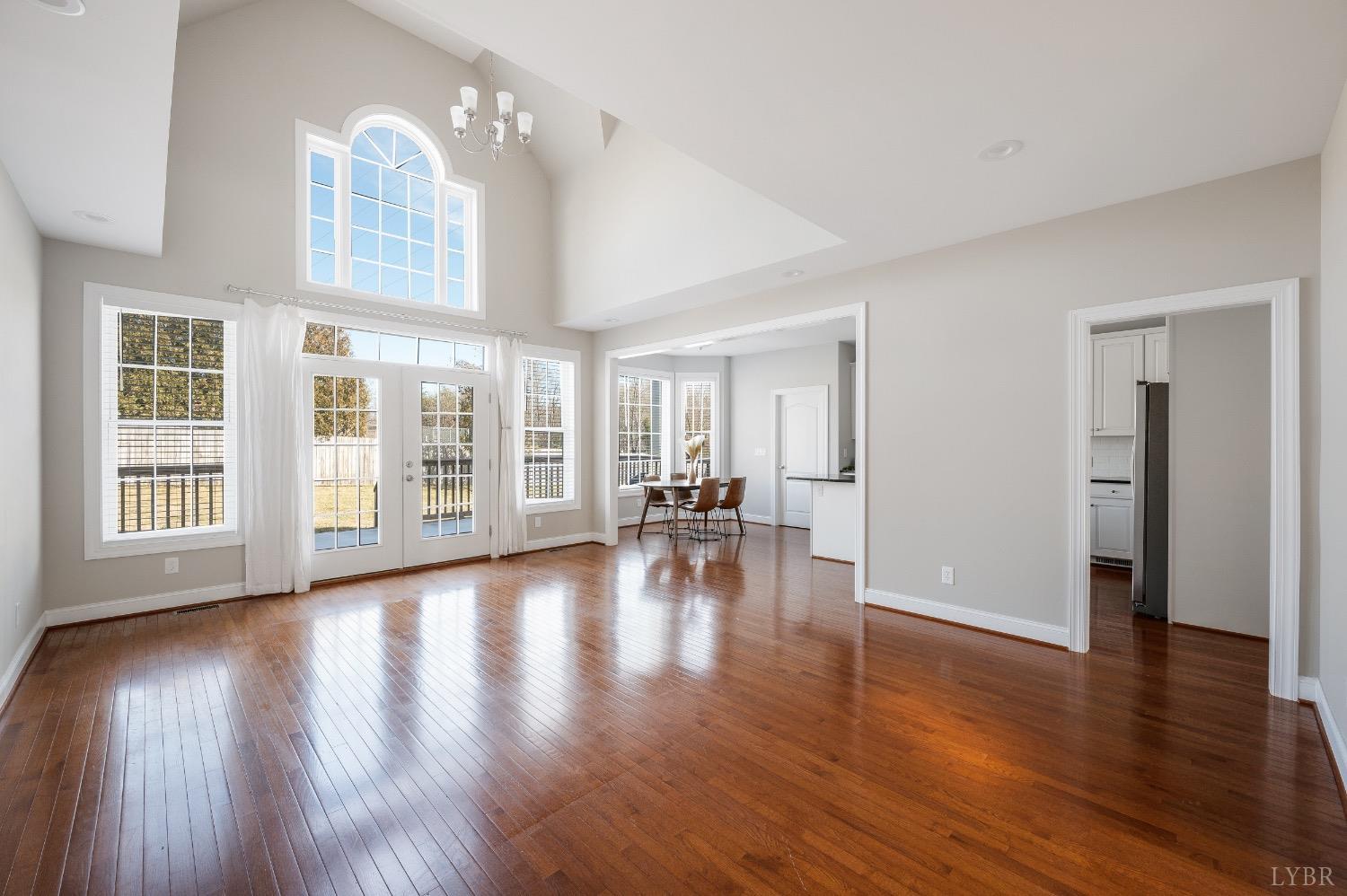 4802 Old Boonsboro Road Lynchburg, VA 24503 - Photo 21 of 57 a view of empty room with wooden floor and floor to ceiling window