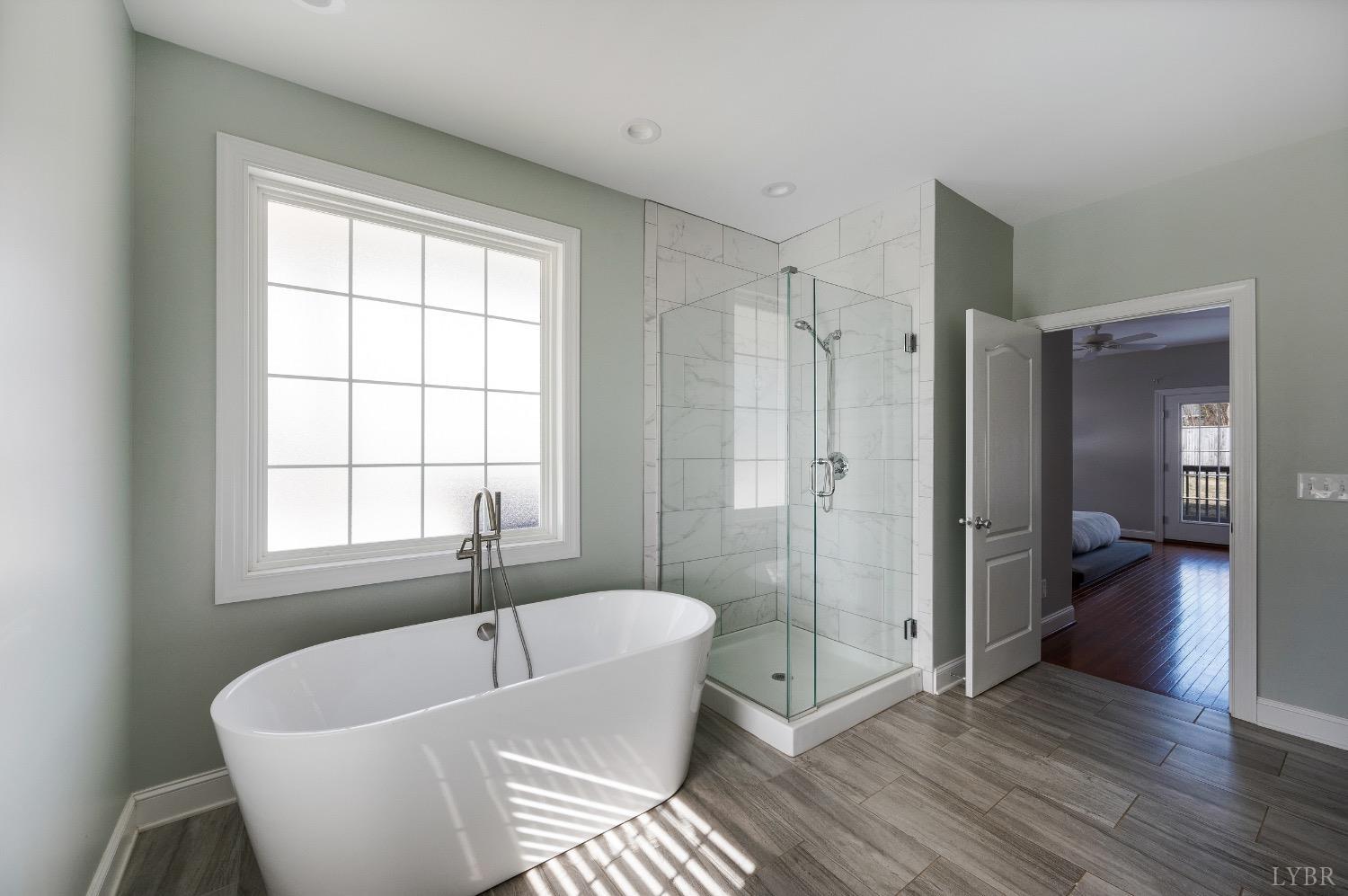 4802 Old Boonsboro Road Lynchburg, VA 24503 - Photo 34 of 57 a white bath tub sitting in a bathroom next to a window