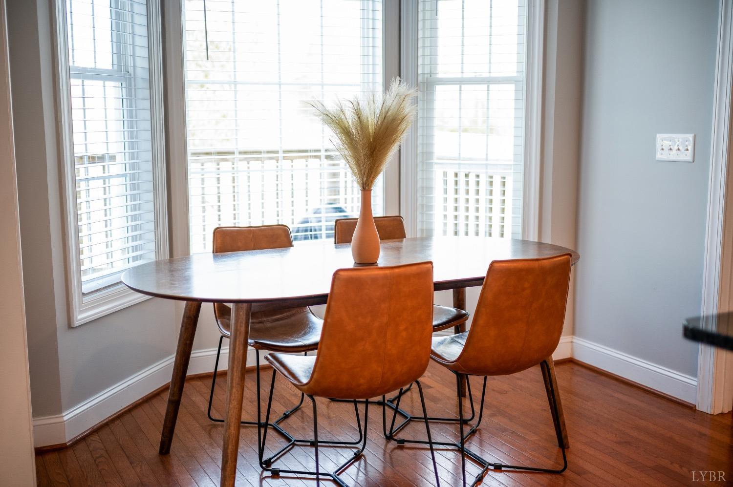 4802 Old Boonsboro Road Lynchburg, VA 24503 - Photo 49 of 57 a view of a dining room with furniture and wooden floor