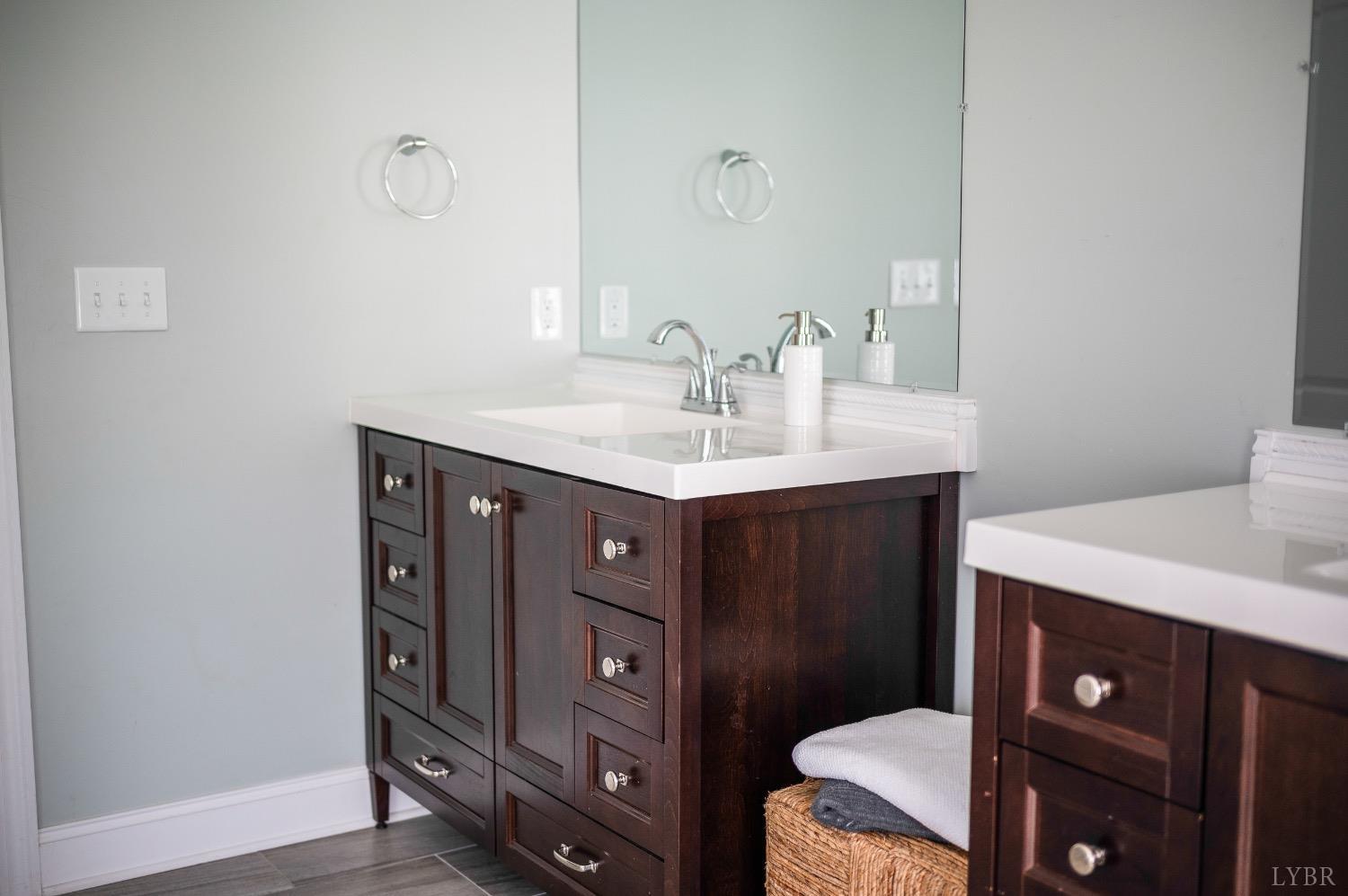 4802 Old Boonsboro Road Lynchburg, VA 24503 - Photo 51 of 57 a bathroom with a granite countertop sink a toilet and a mirror