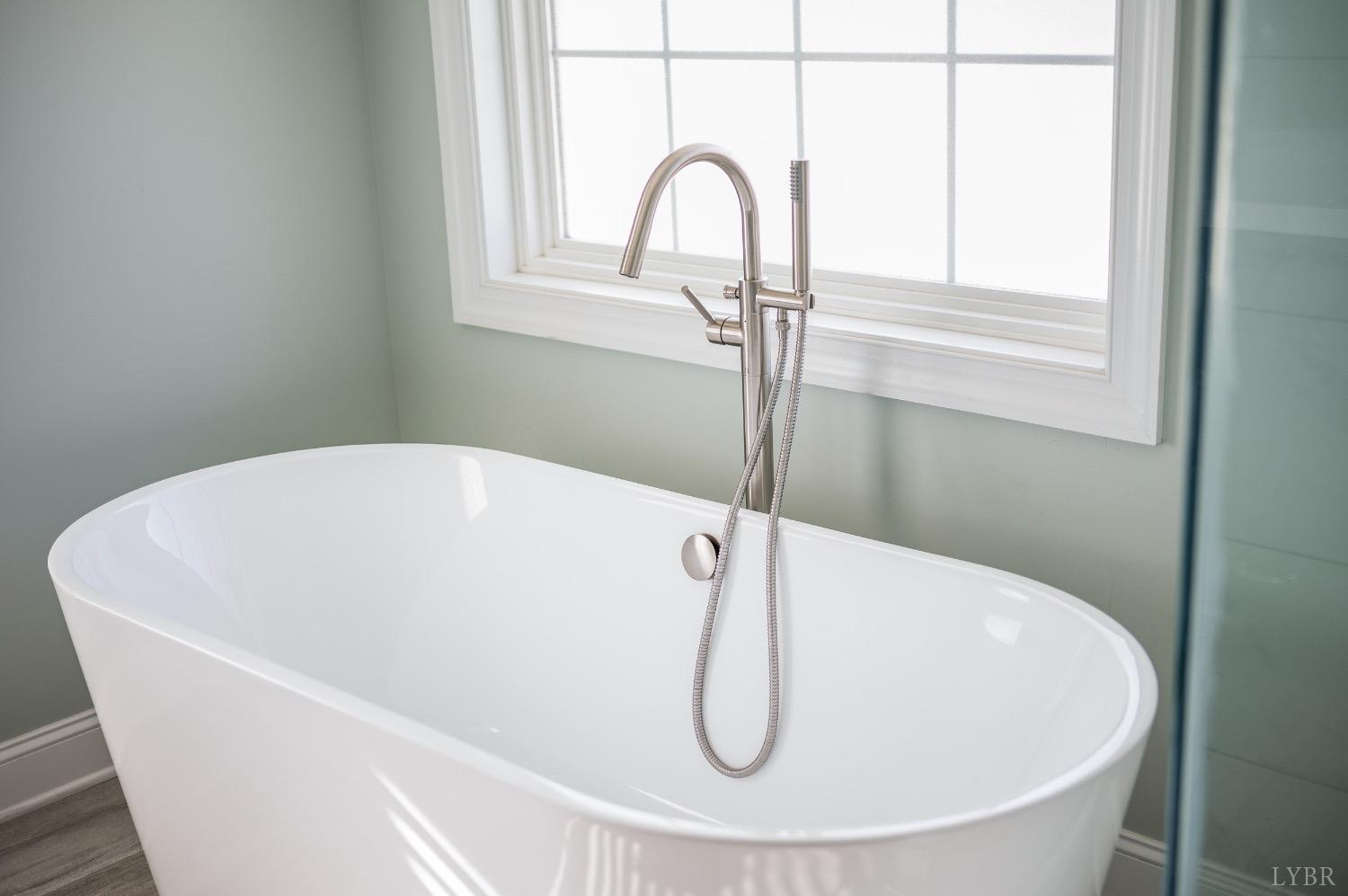 4802 Old Boonsboro Road Lynchburg, VA 24503 - Photo 52 of 57 a white bath tub sitting in a bathroom