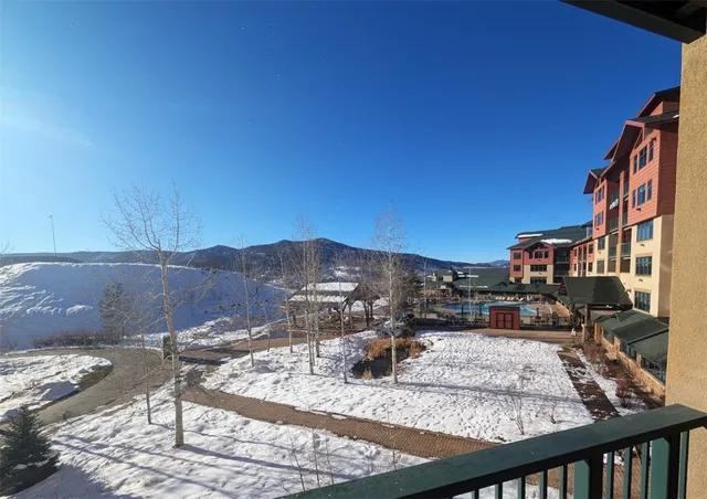 a view of a swimming pool with outdoor seating