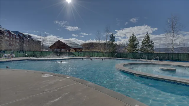a view of a patio with chairs and tables on the patio