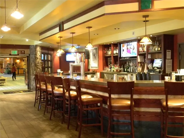 a front view of a house with a yard and garden