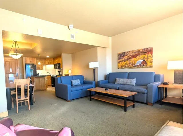 a kitchen with stainless steel appliances granite countertop a refrigerator stove microwave and sink