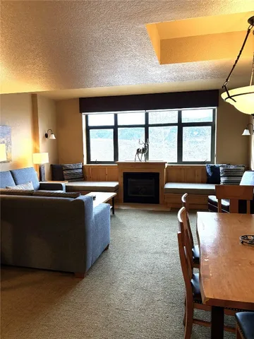 a view of a chairs and table in a room