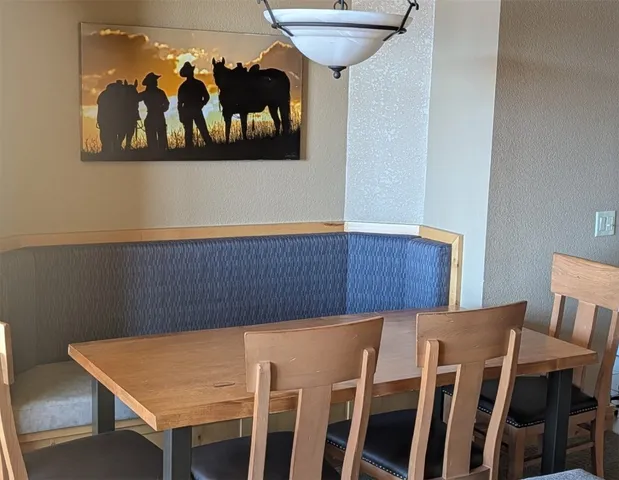 a bedroom with a bed and a tv