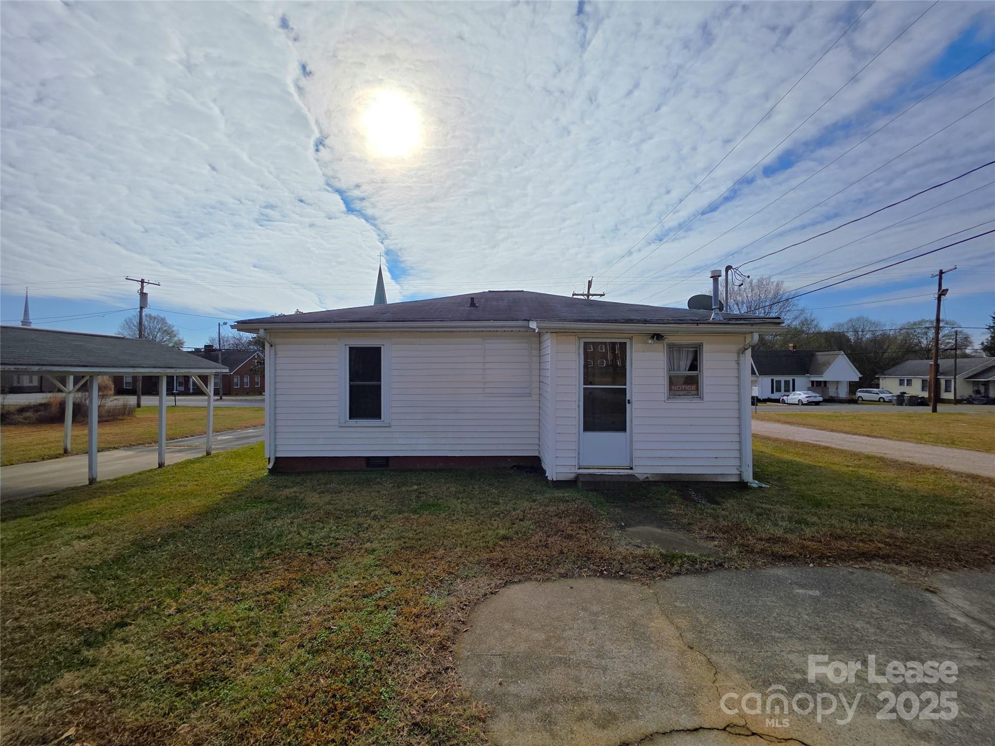 110 West 22nd Street Kannapolis, NC 28081 - Photo 13 of 15 a view of a house with a yard