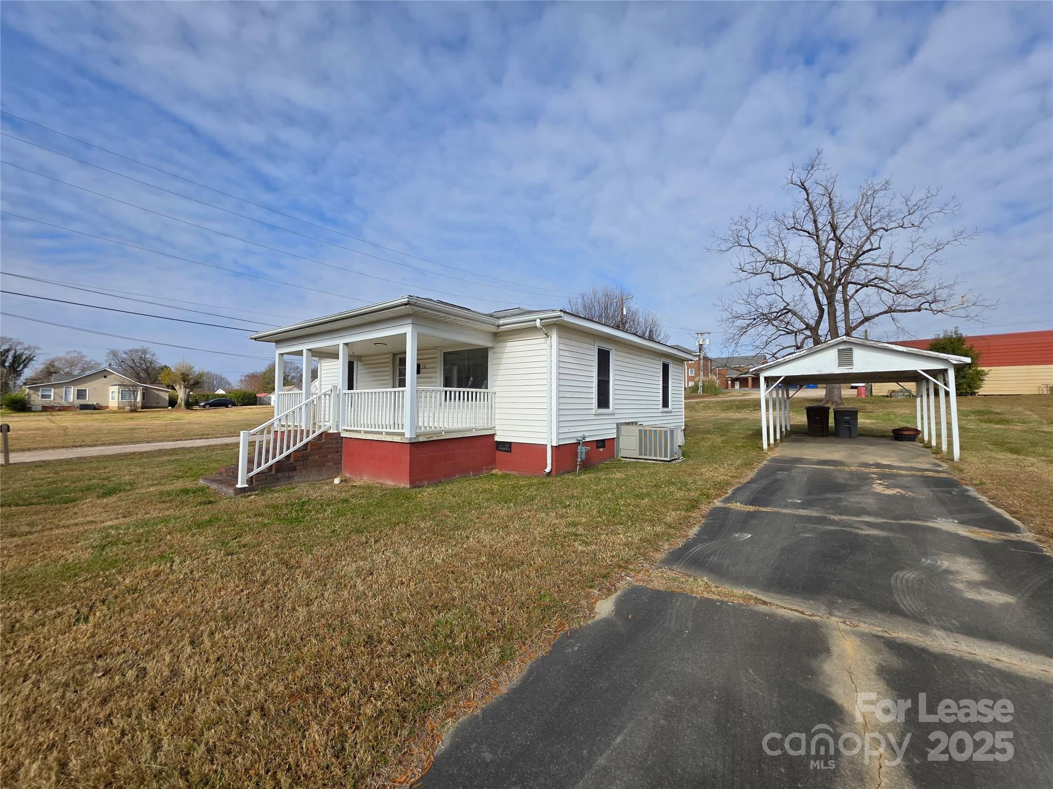 110 West 22nd Street Kannapolis, NC 28081 - Photo 14 of 15 a view of a house with a yard
