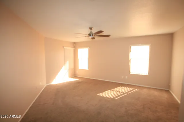 a bathroom with a toilet sink and a mirror