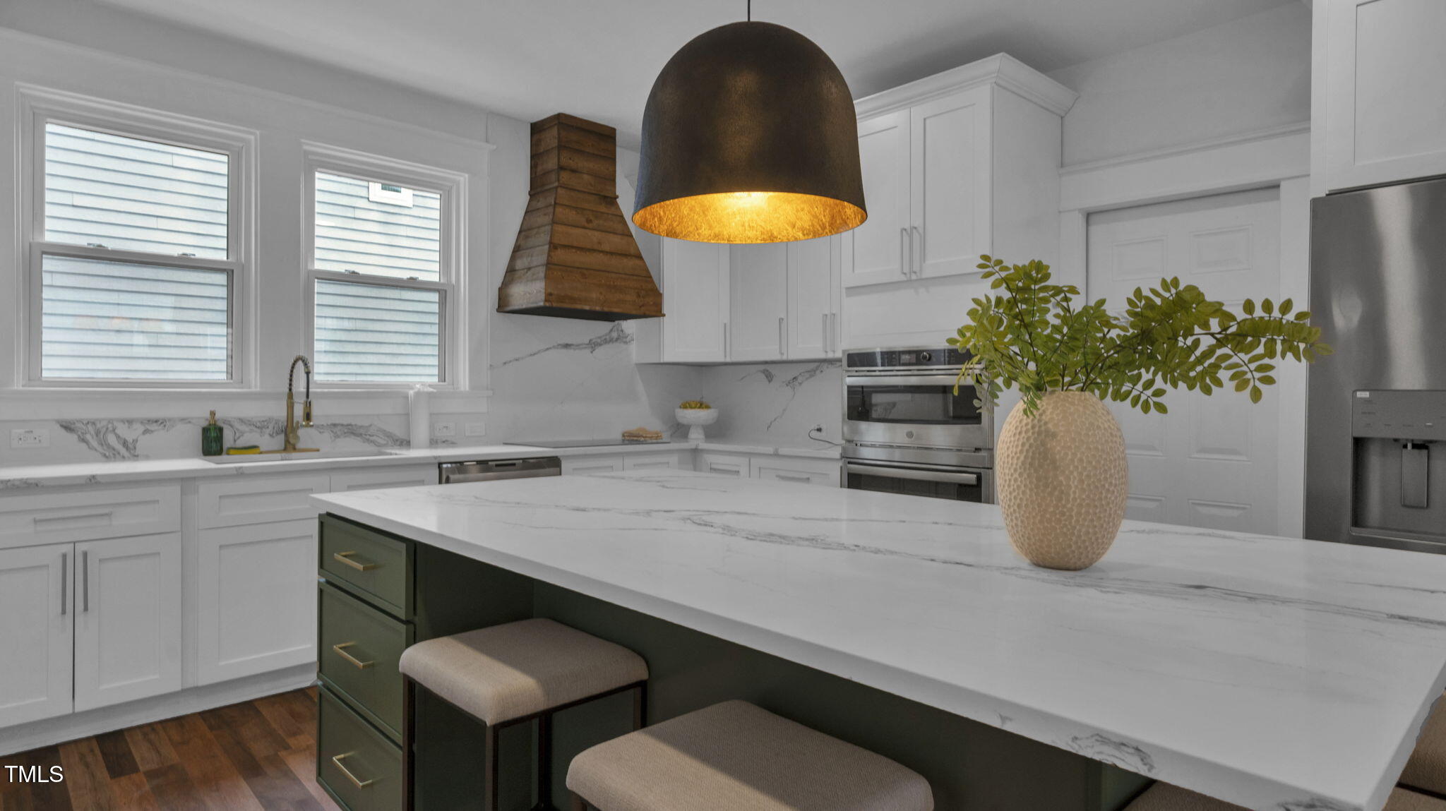 1307 Wake Forest Road Raleigh, NC 27604 - Photo 12 of 51 a kitchen with a sink and a potted plant