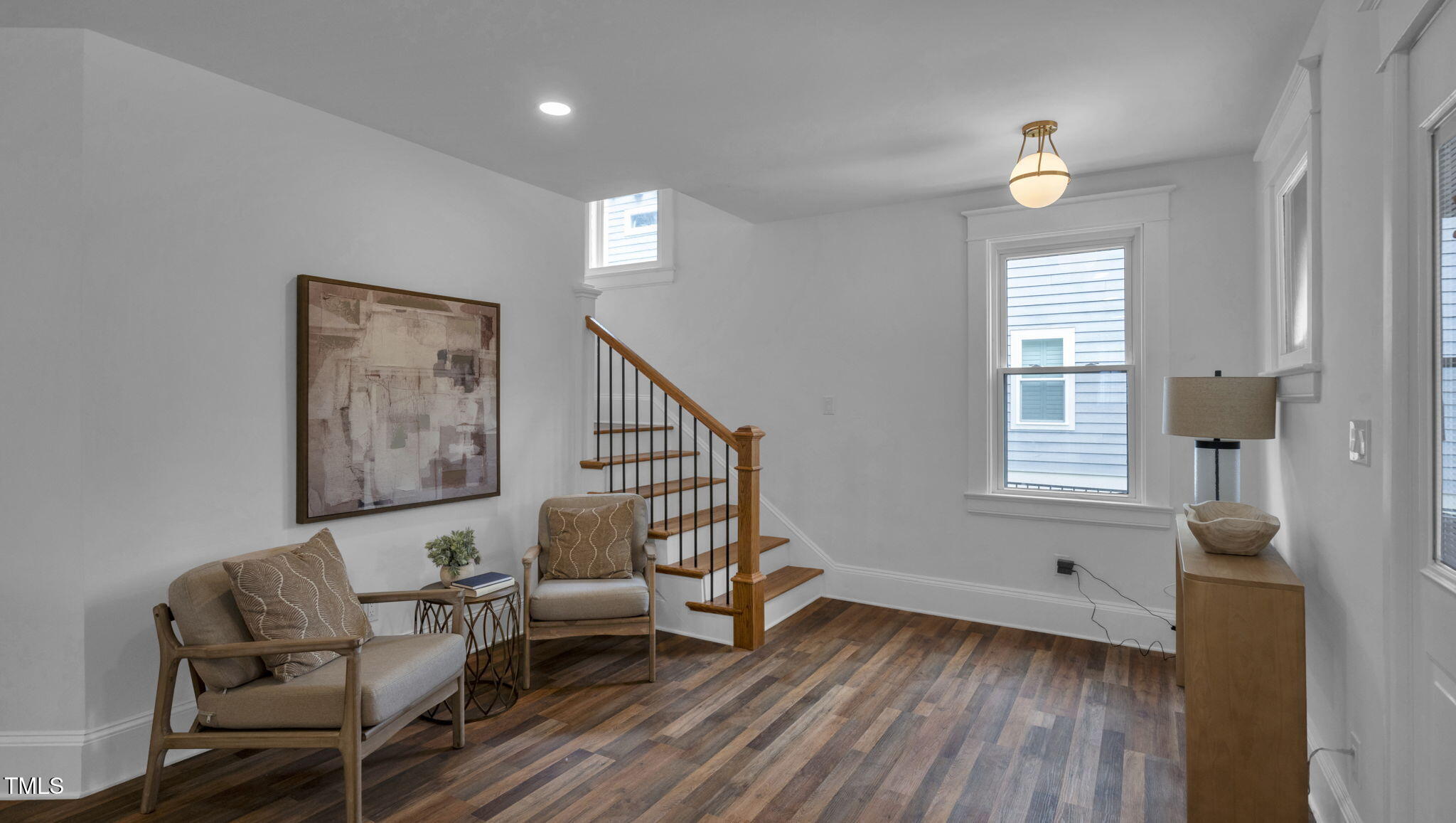 1307 Wake Forest Road Raleigh, NC 27604 - Photo 16 of 51 a living room with furniture and a wooden floor