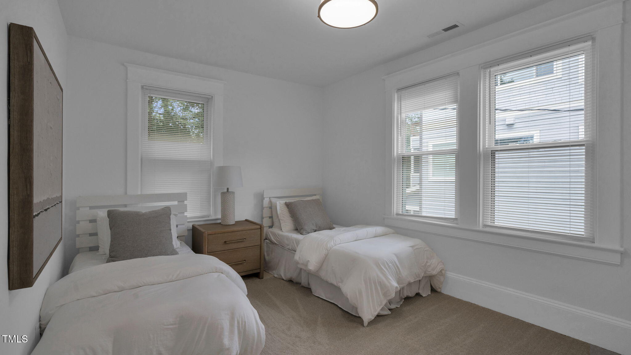 1307 Wake Forest Road Raleigh, NC 27604 - Photo 31 of 51 a bedroom with two beds and a window
