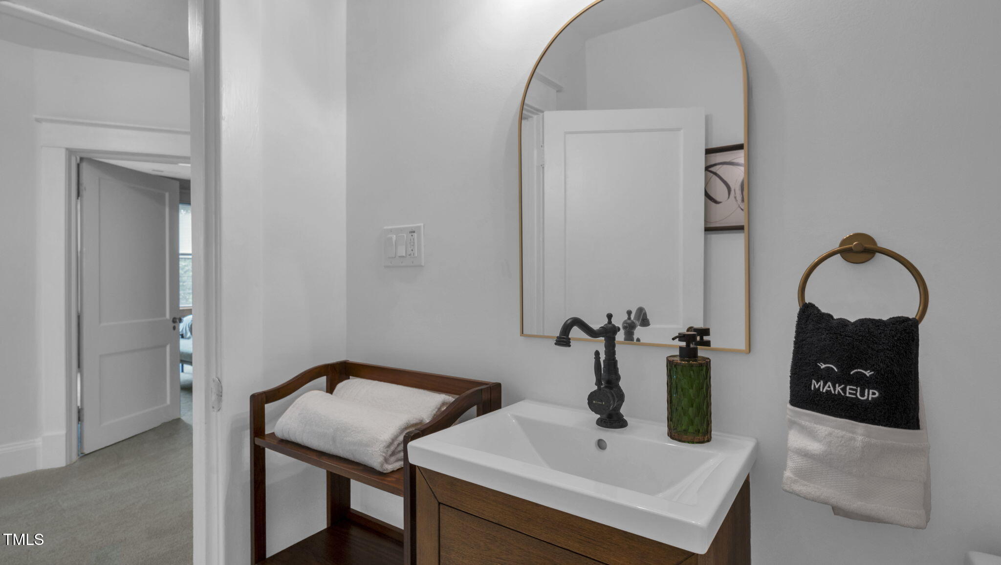 1307 Wake Forest Road Raleigh, NC 27604 - Photo 38 of 51 a bathroom with a sink and a mirror