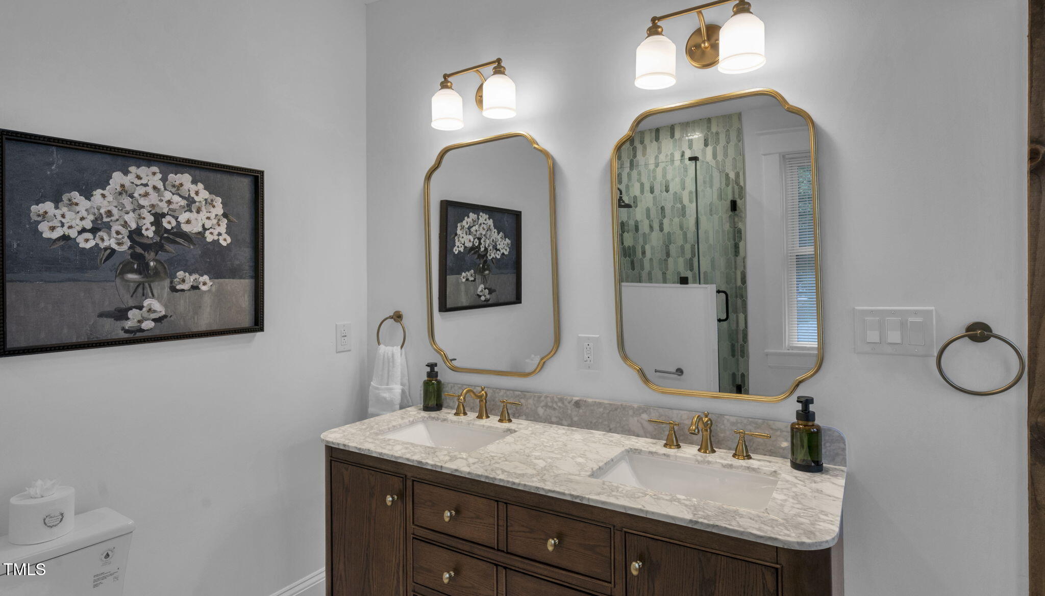 1307 Wake Forest Road Raleigh, NC 27604 - Photo 44 of 51 a bathroom with a double vanity sink and a mirror