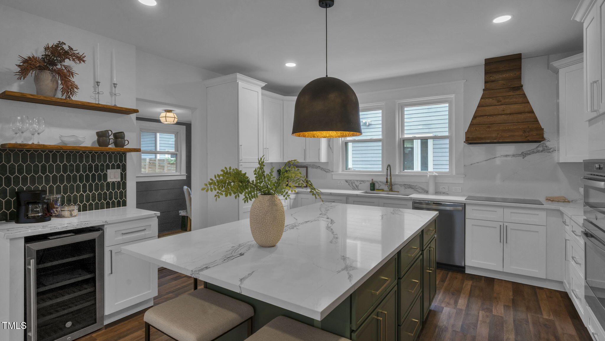 1307 Wake Forest Road Raleigh, NC 27604 - Photo 9 of 51 a kitchen with a table chairs sink and cabinets