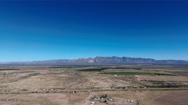 a view of a yard with an ocean