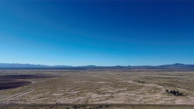 a view of ocean with sunset