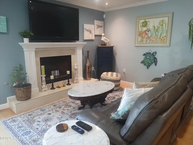 a view of a dining room with furniture and a potted plant