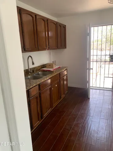 a bathroom with a sink toilet and mirror