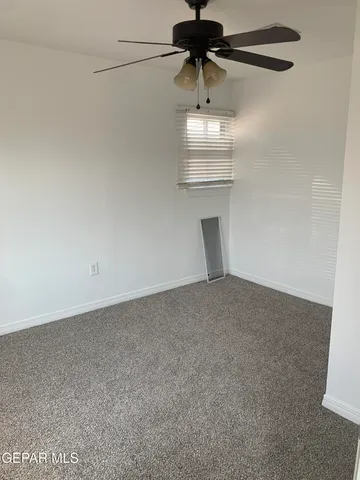 a view of a car parked in front of a house