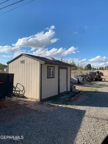 a view of a car park in front of house