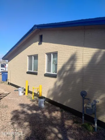 a front view of a house with parking area