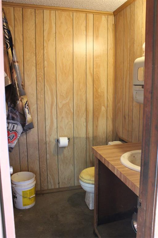 105 South 5th Street Goree, TX 76363 - Photo 10 of 11 a bathroom with a sink a toilet and shower curtain