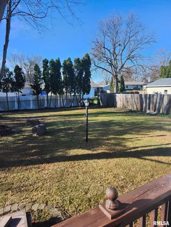 a view of a backyard with a chair