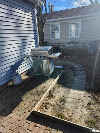 a view of a chairs and table in patio