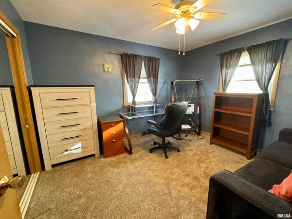 a workspace with furniture and a window