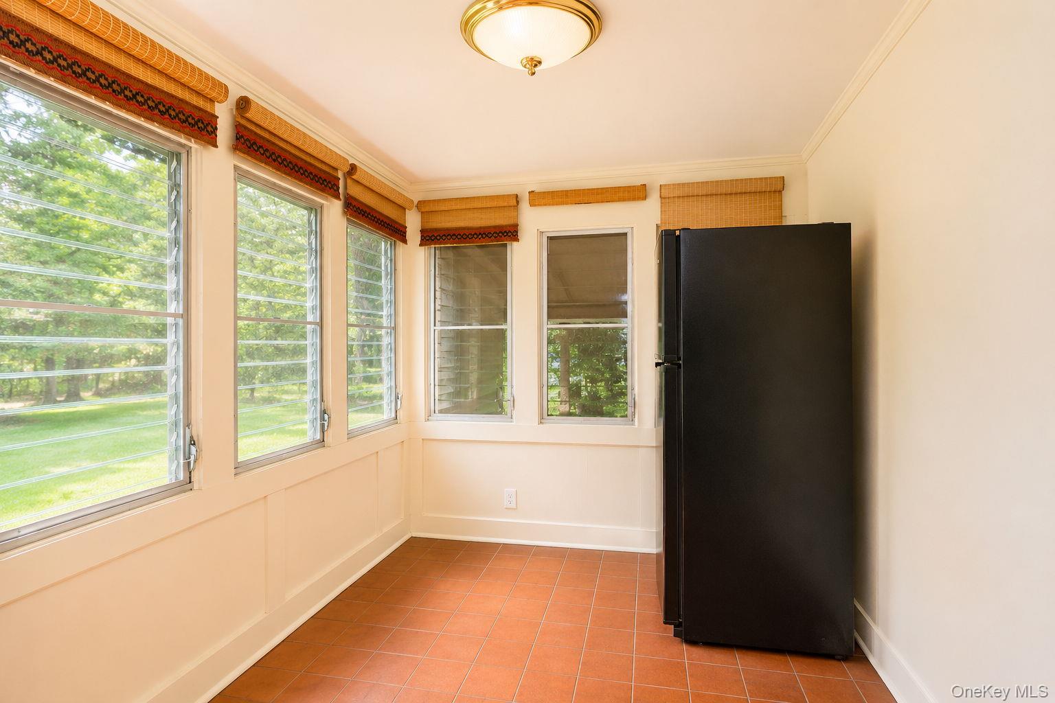 15 Well Road Walden, NY 12586 - Photo 24 of 40 Back porch/dining area with refrigerator AI enhanced
