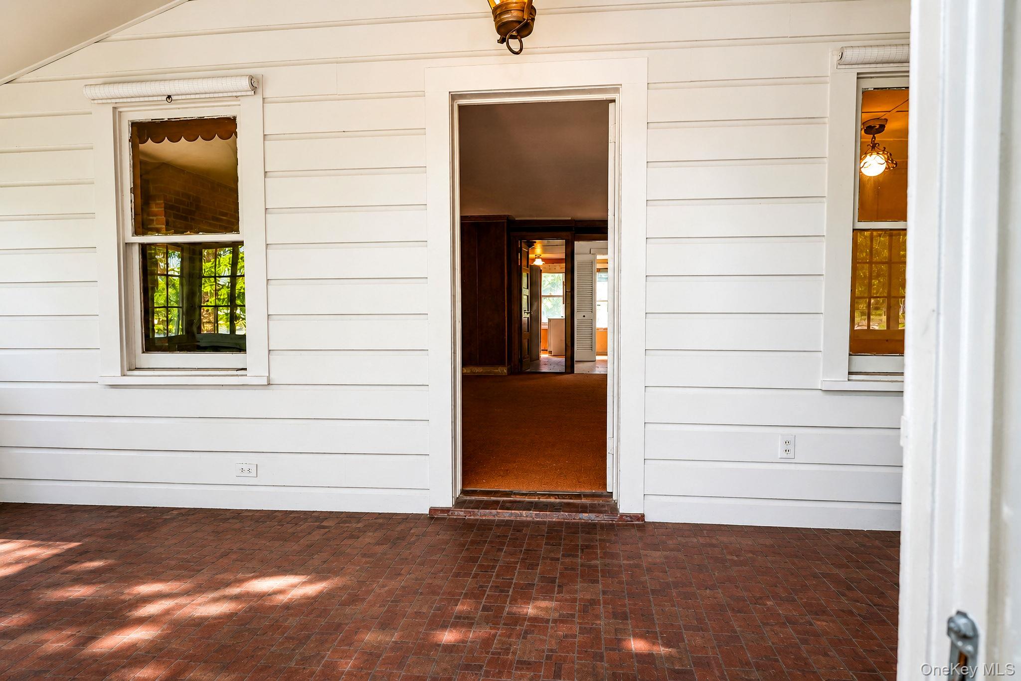 15 Well Road Walden, NY 12586 - Photo 8 of 40 Front porch entryway AI enhanced