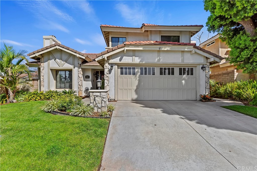 2665 Hampton Way Riverside, CA 92506 - Photo 1 of 1 a front view of a house with a garden and plants