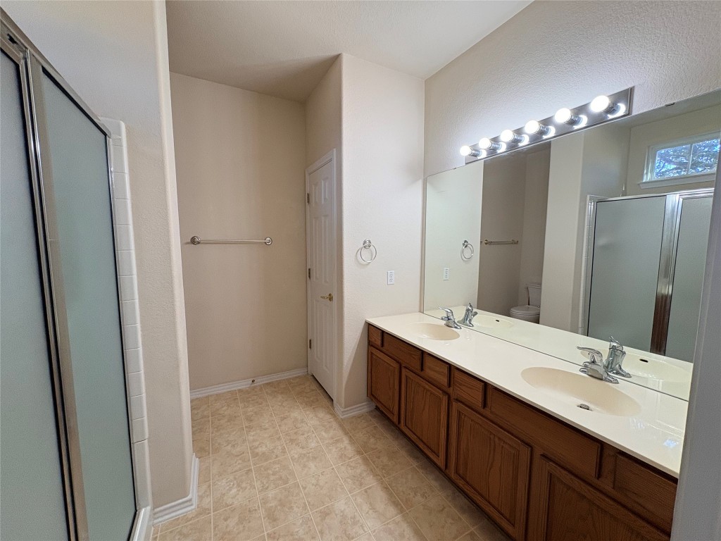 318 Crockett Loop Georgetown, TX 78633 - Photo 18 of 29 a bathroom with a double vanity sink mirror and double