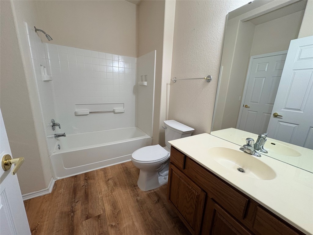 318 Crockett Loop Georgetown, TX 78633 - Photo 23 of 29 a bathroom with a sink a toilet and shower