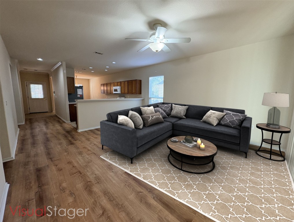 318 Crockett Loop Georgetown, TX 78633 - Photo 4 of 29 a living room with furniture a rug and kitchen view
