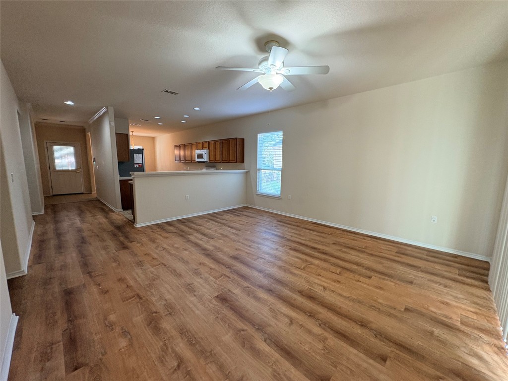 318 Crockett Loop Georgetown, TX 78633 - Photo 5 of 29 a view of a kitchen with a sink and a chandelier