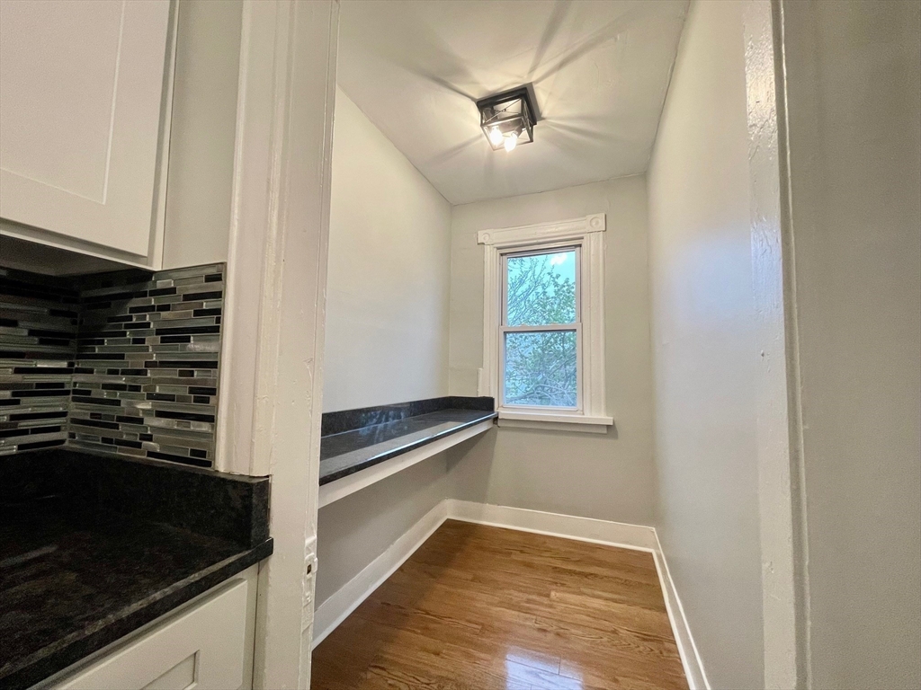 119 Revere Street, Unit 3 Springfield, MA 01108 - Photo 5 of 16 a view of an empty room with a kitchen