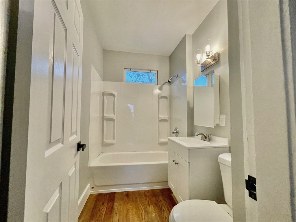 119 Revere Street, Unit 3 Springfield, MA 01108 - Photo 6 of 16 a bathroom with a tub toilet and shower