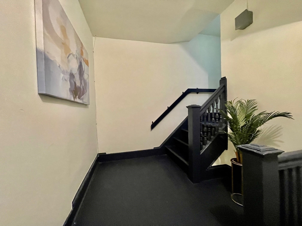 119 Revere Street, Unit 3 Springfield, MA 01108 - Photo 9 of 16 a view of an entryway with wooden floor