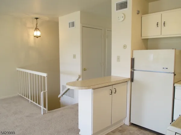 a view of a hallway with washer and dryer