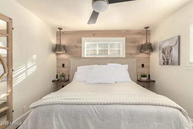 a large white bed in a white room