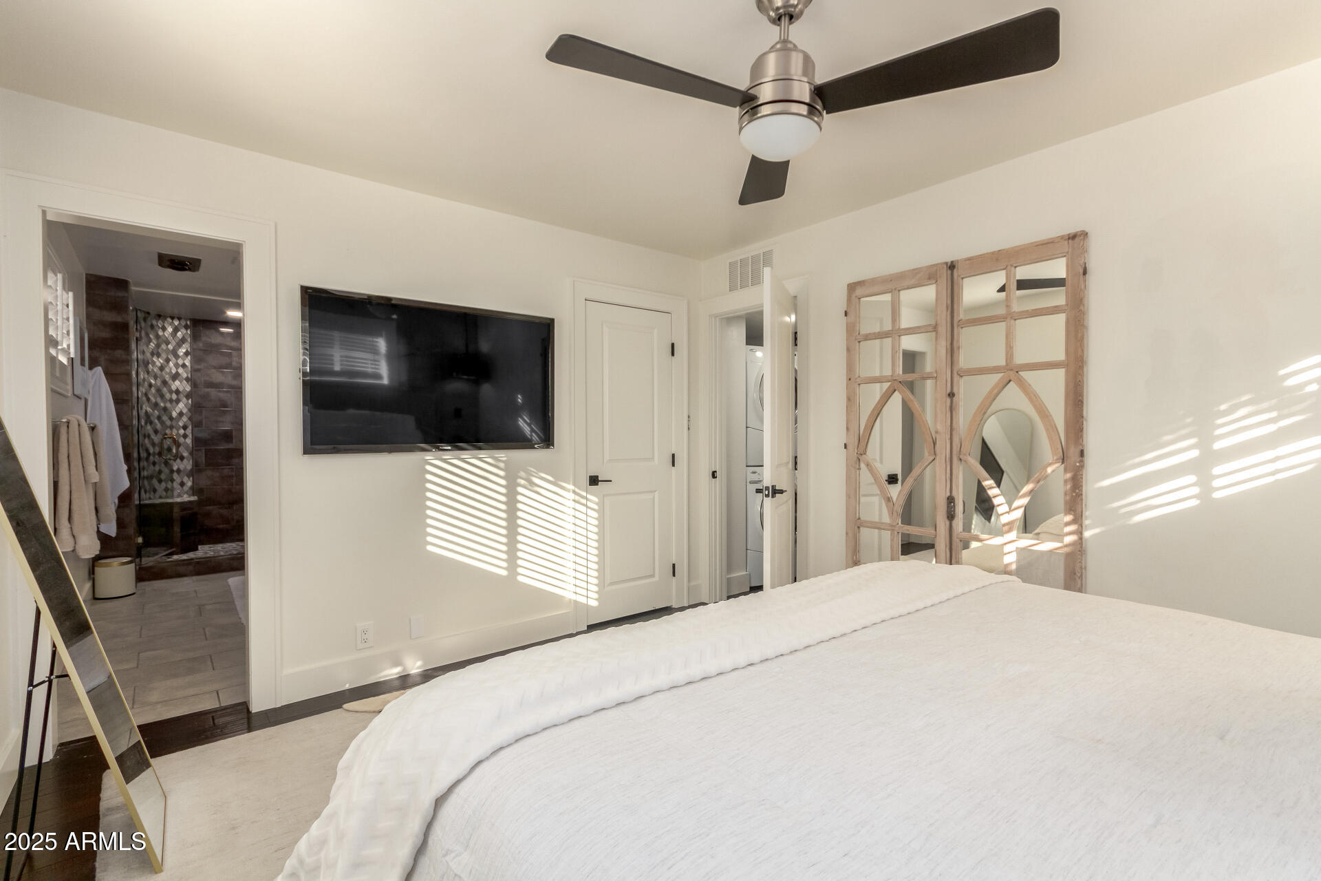 1935 East Coolidge Street Phoenix, AZ 85016 - Photo 18 of 34 a bedroom with a bed tv and a window